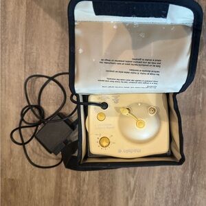 Medela Pump with Black and Yellow Design